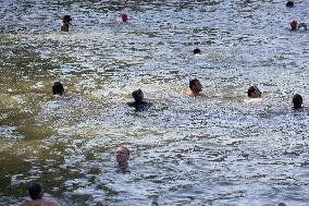 People Swimming In The Seine River - Paris