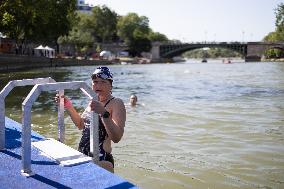 People Swimming In The Seine River - Paris