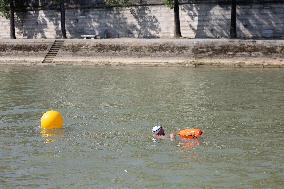 People Swimming In The Seine River - Paris