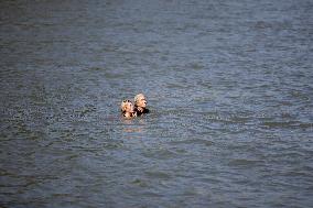 People Swimming In The Seine River - Paris