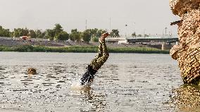 Iraqi Youth Swim Tigris River - Baghdad