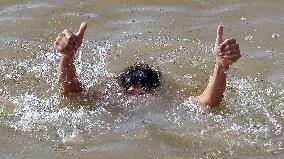 Iraqi Youth Swim Tigris River - Baghdad