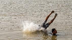 Iraqi Youth Swim Tigris River - Baghdad