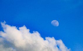 Waxing Gibbous Moon With Cumulus Clouds