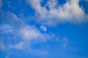 Waxing Gibbous Moon With Cumulus Clouds