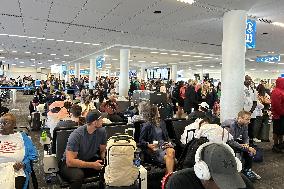 IT Outage Brings Airport Chaos - JFK