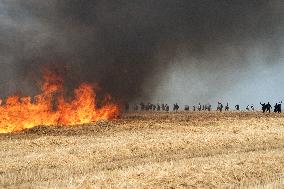 Large Mobilization Against The Mega-basins Near Poitiers And The Firing Of Tear Gas Started A Fire