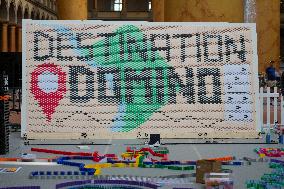 Domino Artist Lily Hevesh Prepares 100,000 Dominos In The National Building Museum For A Topple.