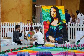 Domino Artist Lily Hevesh Prepares 100,000 Dominos In The National Building Museum For A Topple.