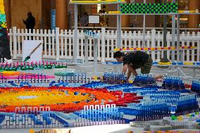 Domino Artist Lily Hevesh Prepares 100,000 Dominos In The National Building Museum For A Topple.