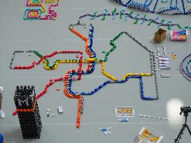 Domino Artist Lily Hevesh Prepares 100,000 Dominos In The National Building Museum For A Topple.