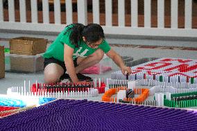 Domino Artist Lily Hevesh Prepares 100,000 Dominos In The National Building Museum For A Topple.