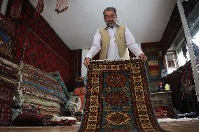 AFGHANISTAN-KABUL-CARPET SELLER