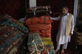 AFGHANISTAN-KABUL-CARPET SELLER