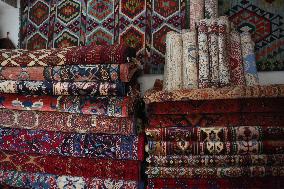 AFGHANISTAN-KABUL-CARPET SELLER