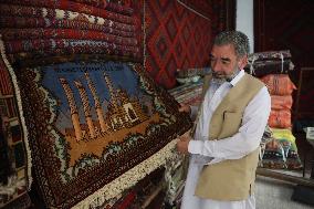 AFGHANISTAN-KABUL-CARPET SELLER