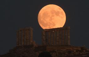 The Buck Full Moon Rises Over The Temple Of Poseidon In Sounio, Athens