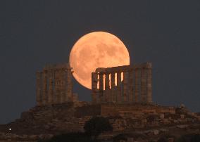 The Buck Full Moon Rises Over The Temple Of Poseidon In Sounio, Athens