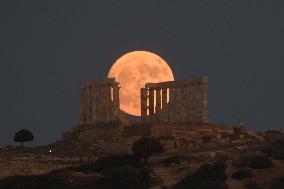 The Buck Full Moon Rises Over The Temple Of Poseidon In Sounio, Athens