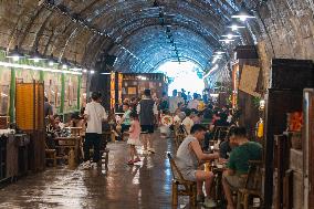 Residents at A Bomb Shelter to Cool Off in Chongqing