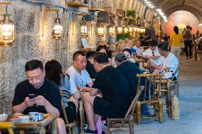 Residents at A Bomb Shelter to Cool Off in Chongqing