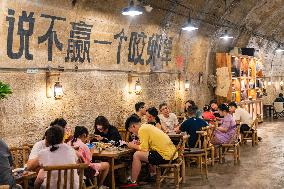 Residents at A Bomb Shelter to Cool Off in Chongqing