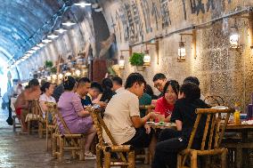 Residents at A Bomb Shelter to Cool Off in Chongqing