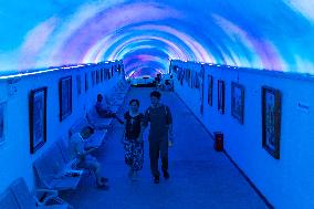 Residents at A Bomb Shelter to Cool Off in Chongqing