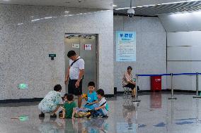 Citizens Cool Off at A Rail Transit Platform in Chongqing