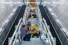 Citizens Cool Off at A Rail Transit Platform in Chongqing