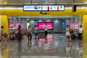 Citizens Cool Off at A Rail Transit Platform in Chongqing