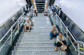 Citizens Cool Off at A Rail Transit Platform in Chongqing