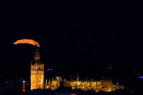 Full Moon Rises Behind The Cathedral - Seville