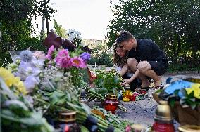 Lviv residents bring flowers to murder site of Iryna Farion