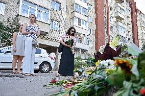 Lviv residents bring flowers to murder site of Iryna Farion