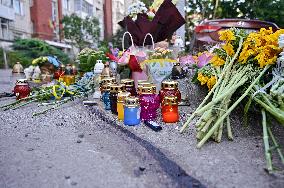 Lviv residents bring flowers to murder site of Iryna Farion