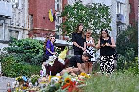 Lviv residents bring flowers to murder site of Iryna Farion