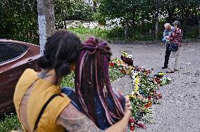 Lviv residents bring flowers to murder site of Iryna Farion