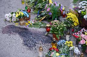 Lviv residents bring flowers to murder site of Iryna Farion