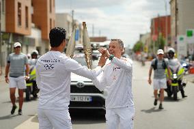 PARIS 2024 - Olympic Torch flame bearer Nasser Al-Khelaifi in Vigneux-sur-Seine