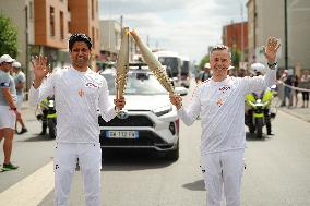 PARIS 2024 - Olympic Torch flame bearer Nasser Al-Khelaifi in Vigneux-sur-Seine