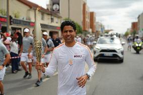 PARIS 2024 - Olympic Torch flame bearer Nasser Al-Khelaifi in Vigneux-sur-Seine