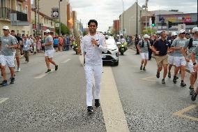 PARIS 2024 - Olympic Torch flame bearer Nasser Al-Khelaifi in Vigneux-sur-Seine