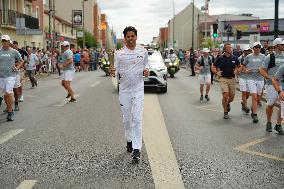 PARIS 2024 - Olympic Torch flame bearer Nasser Al-Khelaifi in Vigneux-sur-Seine