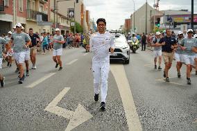 PARIS 2024 - Olympic Torch flame bearer Nasser Al-Khelaifi in Vigneux-sur-Seine