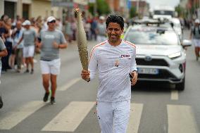 PARIS 2024 - Olympic Torch flame bearer Nasser Al-Khelaifi in Vigneux-sur-Seine