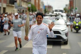 PARIS 2024 - Olympic Torch flame bearer Nasser Al-Khelaifi in Vigneux-sur-Seine