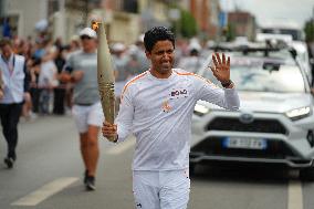 PARIS 2024 - Olympic Torch flame bearer Nasser Al-Khelaifi in Vigneux-sur-Seine