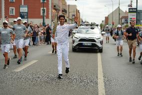 PARIS 2024 - Olympic Torch flame bearer Nasser Al-Khelaifi in Vigneux-sur-Seine