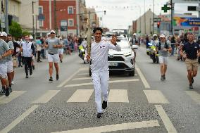 PARIS 2024 - Olympic Torch flame bearer Nasser Al-Khelaifi in Vigneux-sur-Seine